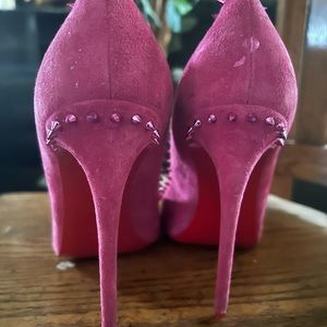 christian louboutin heels. No box . Scuff under the heel on both